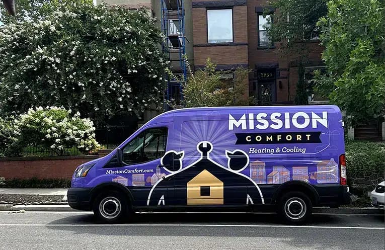 Mission Comfort Heating & Cooling truck outside of apartment building in Waldorf, MD.