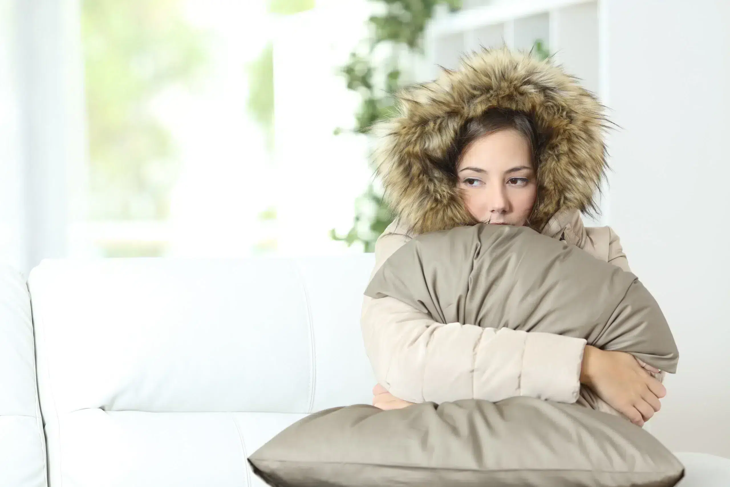 cold woman on couch