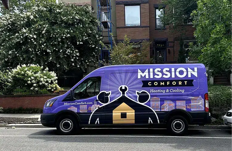 Mission Comfort Heating & Cooling truck outside of apartment building in Waldorf, MD.