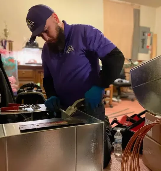 Mission Comfort tech installing furnace