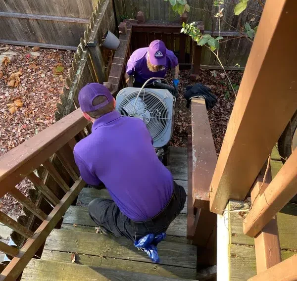 Mission Comfort techs and air conditioner